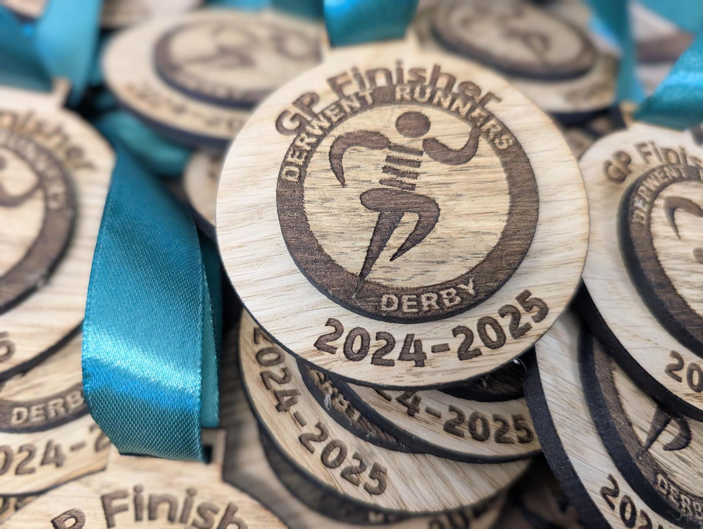 Personalised wooden double layer medals with or without ribbon. Custom wooden medals that include any wording and logo. Alternative medals