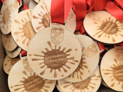 Personalised wooden medals with or without ribbon. Custom wooden medals that can include any wording and logo.