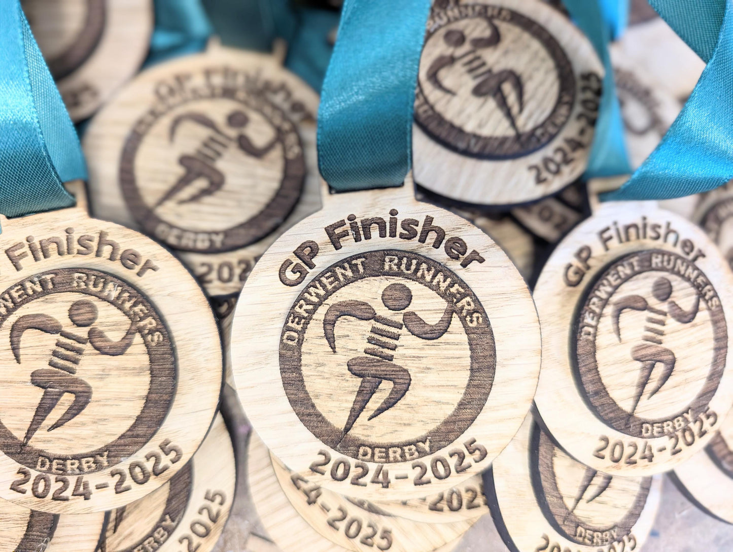 Personalised wooden double layer medals with or without ribbon. Custom wooden medals that include any wording and logo. Alternative medals