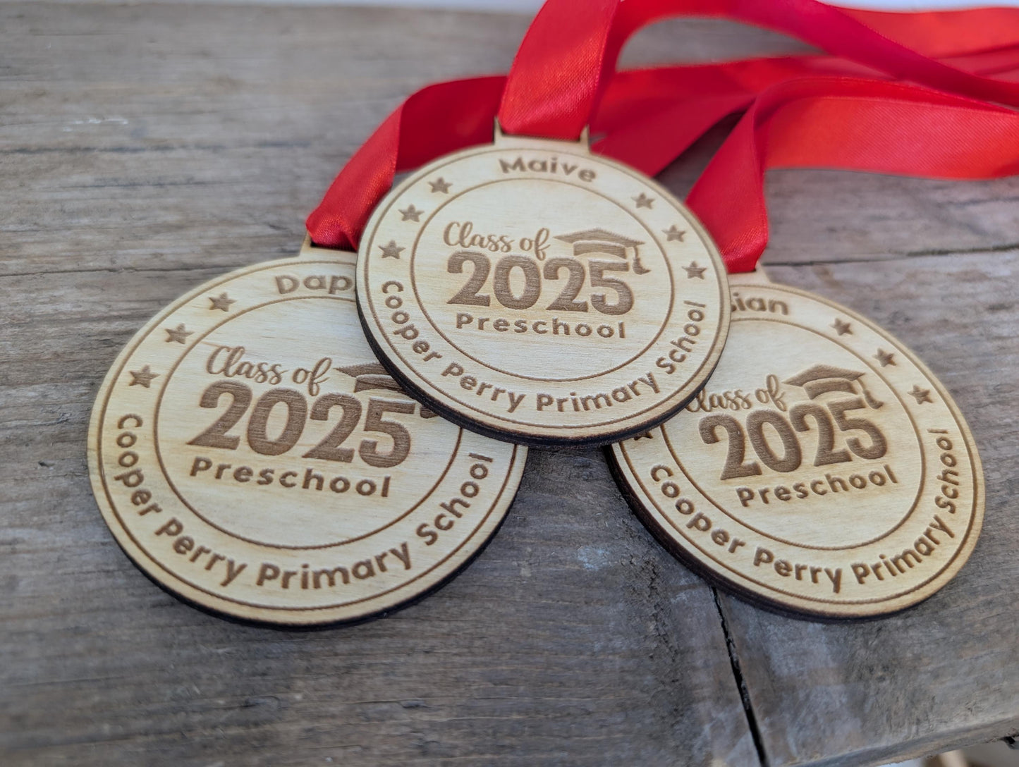 Personalised preschool graduation wooden medals. Wooden custom nursery graduation medals that can include any wording and name.