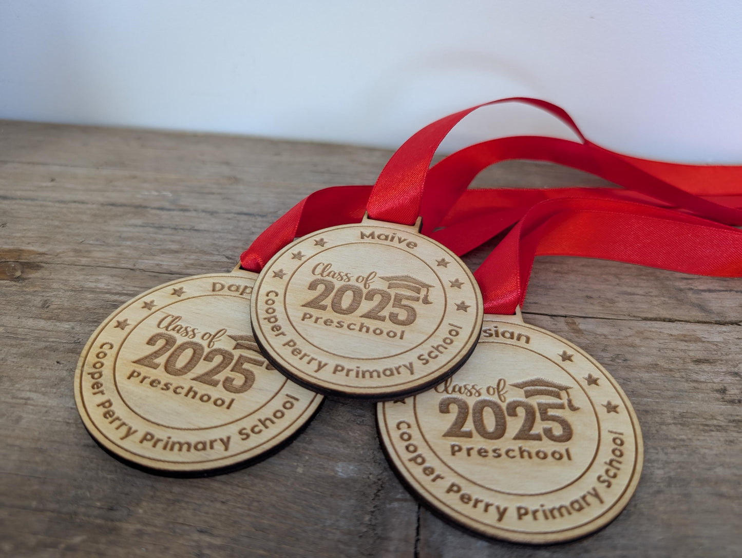 Personalised preschool graduation wooden medals. Wooden custom nursery graduation medals that can include any wording and name.