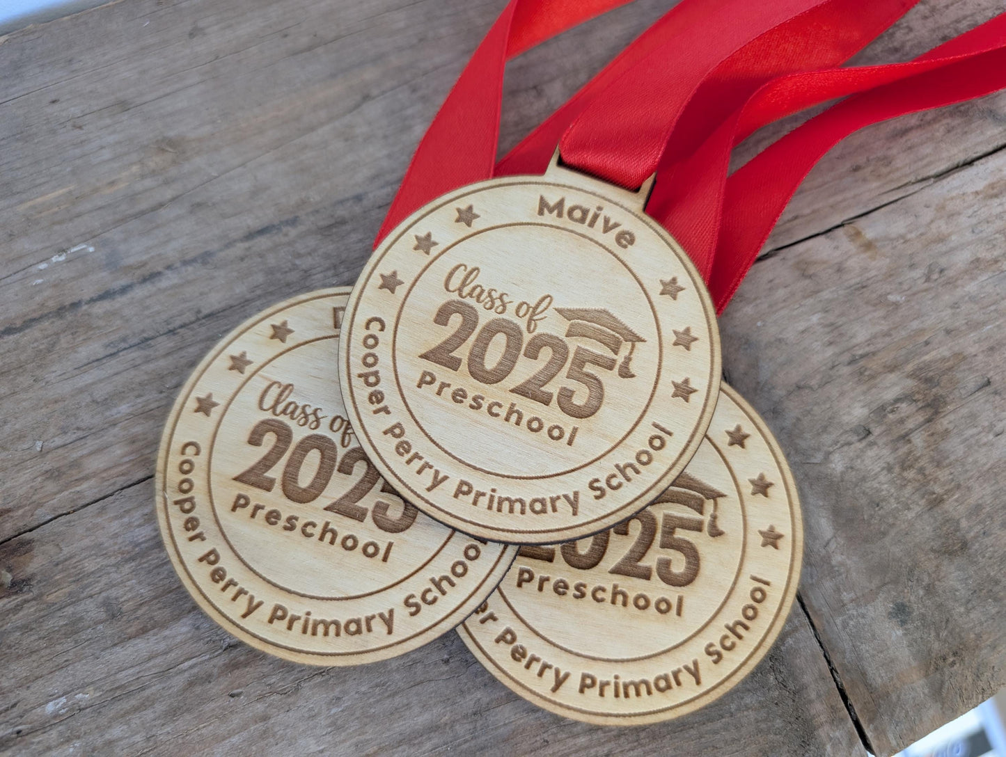 Personalised preschool graduation wooden medals. Wooden custom nursery graduation medals that can include any wording and name.